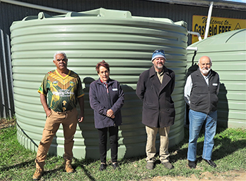 Jubullum Aboriginal community member Daniel Walker, Vinnies St Therese Casino Conference president Marlene Landrigan, The Shed of Hope’s Greg Dollin and Vinnies Richmond Regional president Michael Albany with the donated water tank.