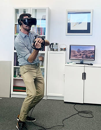  Dr Jarrad (aka Luke Skywalker) Watt, Rehabilitation Consultant, using a virtual lightsaber to fight off attacking stormtroopers and defend the millennium falcon.